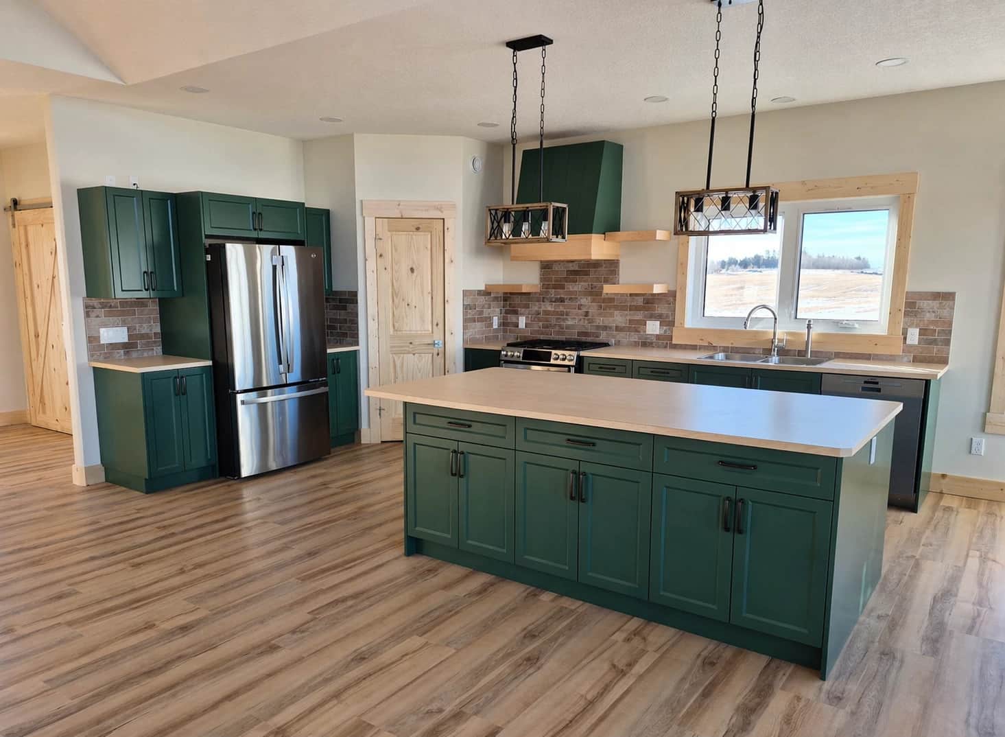 Green painted kitchen with floating shelves