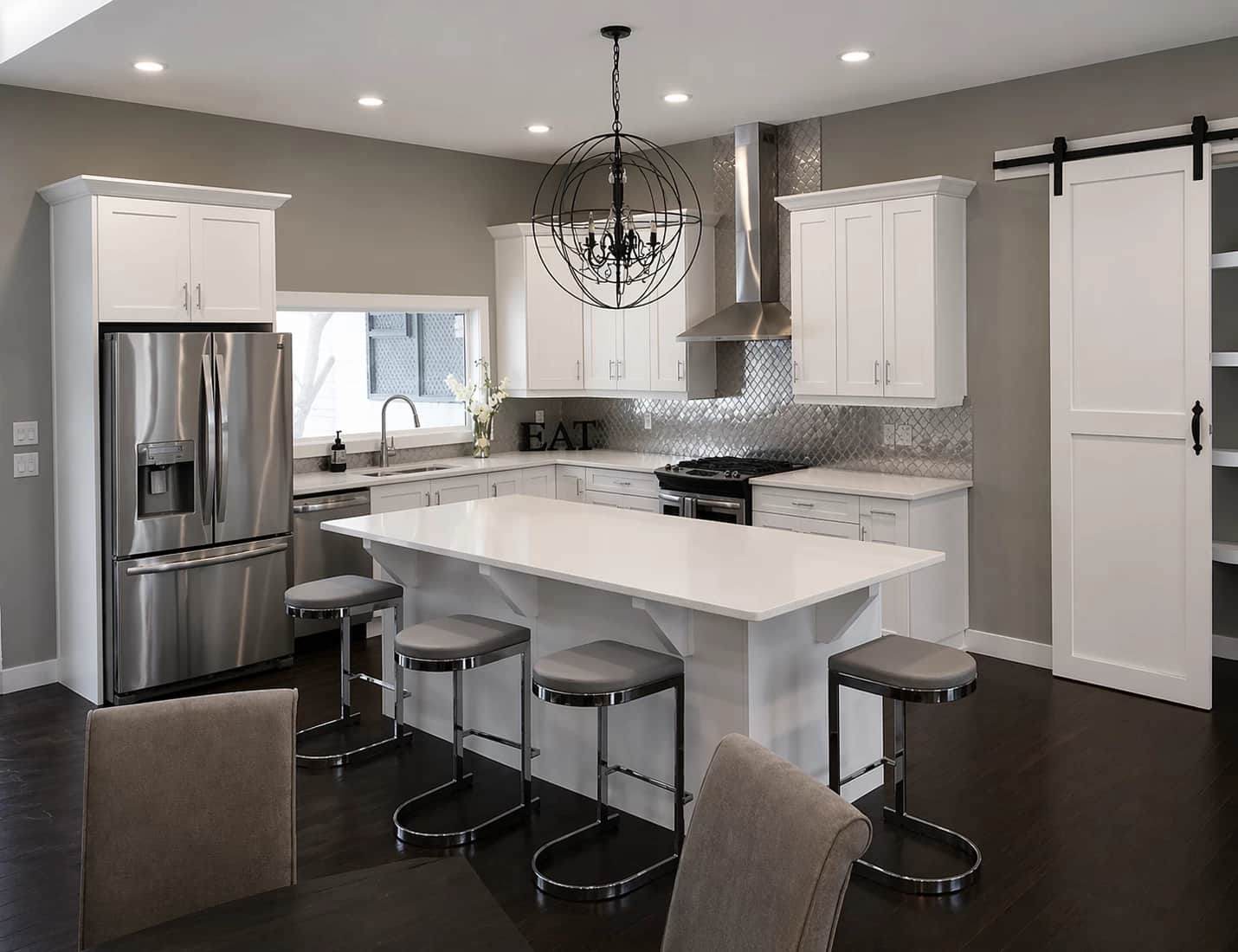 White modern kitchen with barn door
